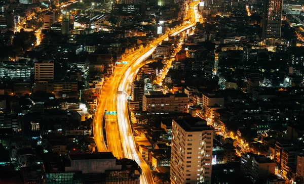 traffic in Bangkok, night cityscape with height, district town