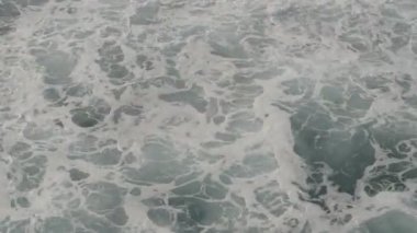 Chaotic waves at the shores of the ocean, roaring water