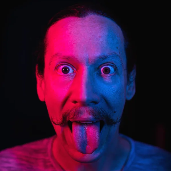 Portrait Man Showing Tongue Blue Red Lighting Emotional Art Photo — Stock Photo, Image