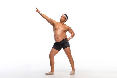 Çok şişman bir adam kendini kremayla doyurur. Obezite ve yeme bozukluğu. Sosyal ağlarda diyet ve fitness reklamları kavramı