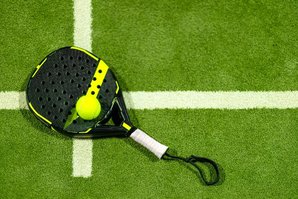 Padel tennis rackets. Sport court and balls. Download a high quality photo with paddle for the design of a sports app or soical media advertisement