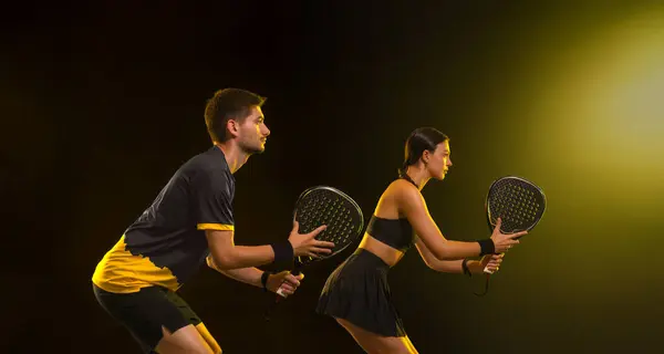 stock image Padel tennis players with racket. Man and woman athletes with racket on court. Sport concept. Download a high quality photo for the design of a sports app or betting site