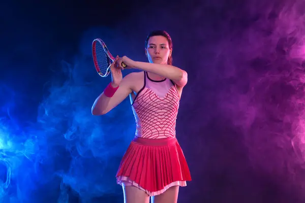 stock image Tennis player with racket. Girl teenager athlete with racket on court with neon colors. Sport concept. Download a high quality photo for the design of a sports app or betting site