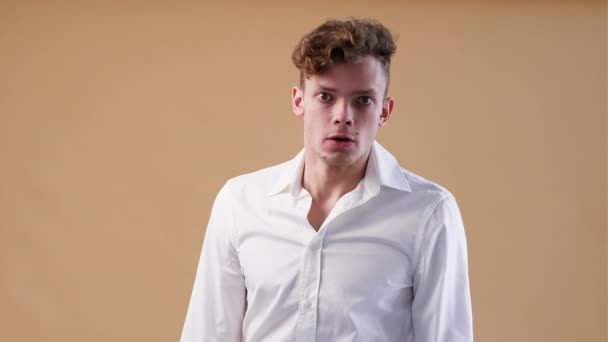 Young Adult Shoeing His Fury Emotions Young Man White Shirt — Stockvideo