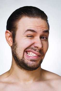 Young man emotional wink portrait