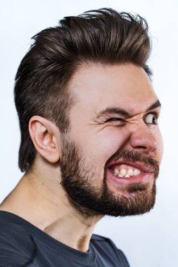 Young crazy danger man emotional portrait on white background