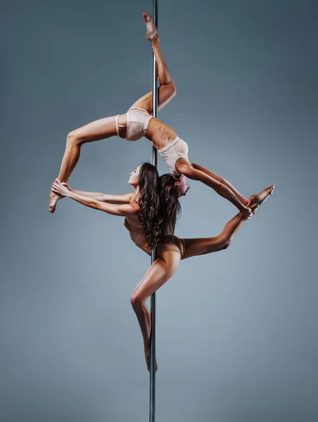 Two Slim Pole Dance Women White Wall Background — Stockfoto