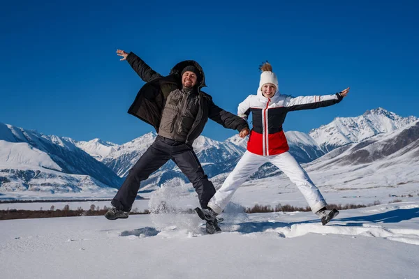Young Happy Man Woman Jumping Mountains Background Winter Season — Stock Photo, Image