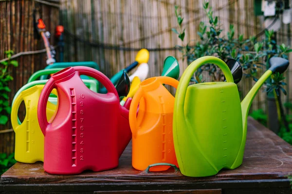 Colorful Watering Cans Garden — Stock Photo, Image
