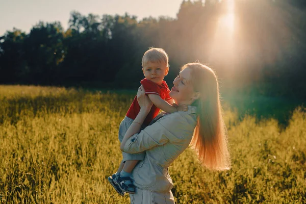 Happy Young Woman Holding Child Her Arms Field — Stock Photo, Image