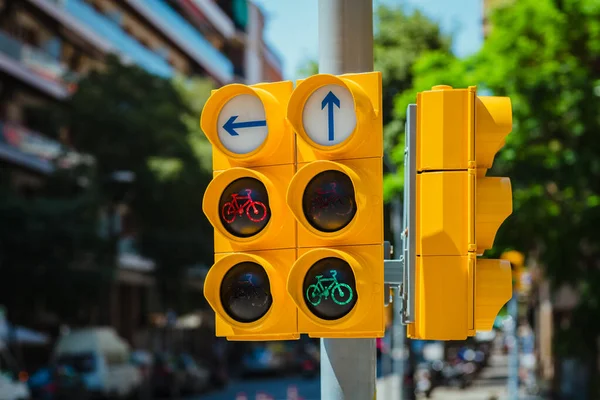 Yellow traffic light with arrows and bicycle traffic signal in Europe city