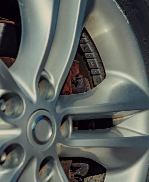 Car wheel close-up view with balance weights inside