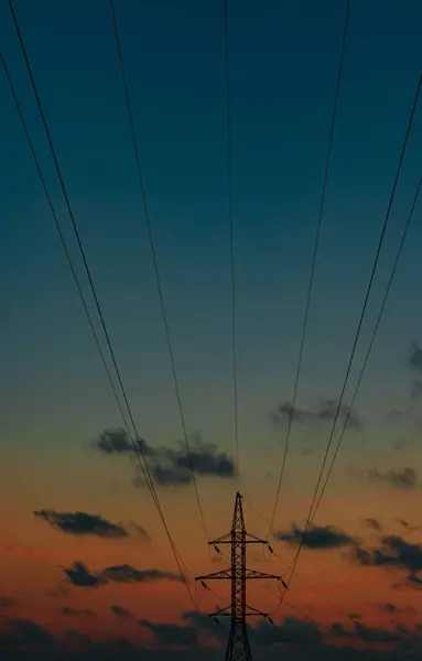 Electric power line at dark sunset light