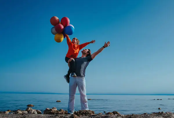 Father Holding His Son Balloons Shore Lake Summer Day — Stock Photo, Image