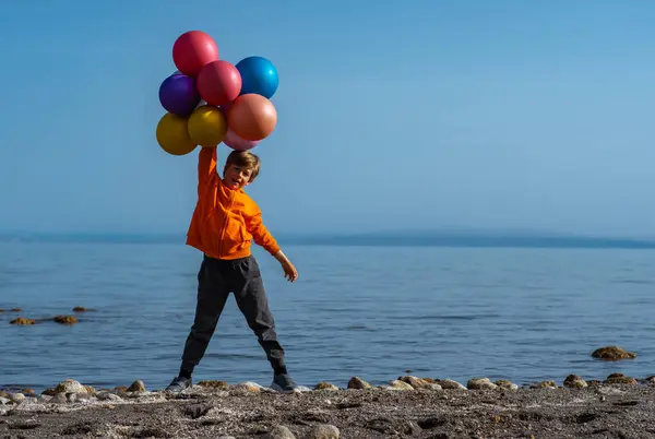 Cheerful Boy Standing Balloons Lake Shore Summer Day — Stock Photo, Image