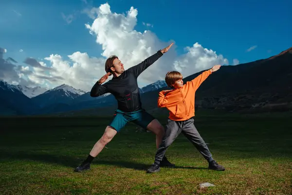 Young Man His Son Training Mountains Twilight Stock Photo