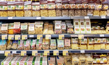 Latvia, Riga, January, 2023 - Shelves with Dalla Costa Pasta of different types with discounts in the shopping mall in Riga, Latvia.