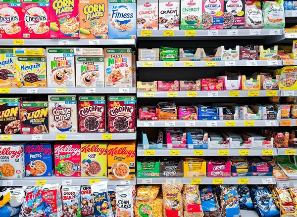 stock image LATVIA, RIGA, APRIL, 2023: Shelves with various dry breakfasts and muesli in assortment on the supermarket, Riga, Latvia