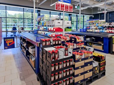 Small endemic frog Brown Mantella (Mantidactylus melanopleura), species of small frog in the Mantellidae family sits on a purple flower in Thailand