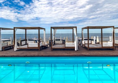 Recreation area with cozy gazebos and swimming pool on the Baltic Sea seaside in Bulduri, Jurmala district, Latvia.  clipart