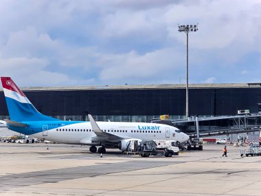 SPAIN, BARCELONA, SEPTEMBER, 28, 2024: Luxembourg airline airplane preparation to fly and loading the airplane with baggage in El Prat Barcelona International airport. Spain clipart