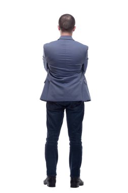 Beyaz arka planda izole edilmiş, geride duran iş adamının tam boy portresi.