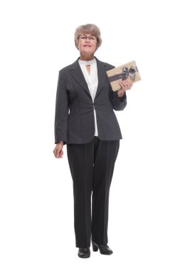 Happy mature woman pointing at camera with tablet pc on white background and smiling