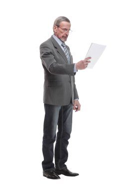 Portrait of a happy mature man dressed in suit holding mobile phone and looking at camera isolated over white background