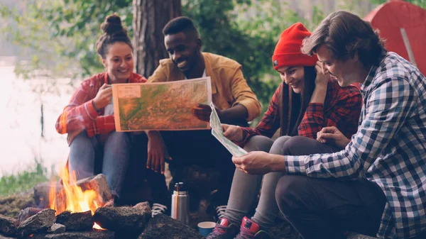 Male Female Friends Tourists Sitting Fire Studying Maps Hike Forest — Stock Photo, Image