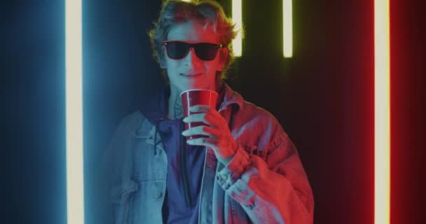 Portrait Young Man Drinking Alcohol Dancing Night Club Neon Illumination — Stock Video