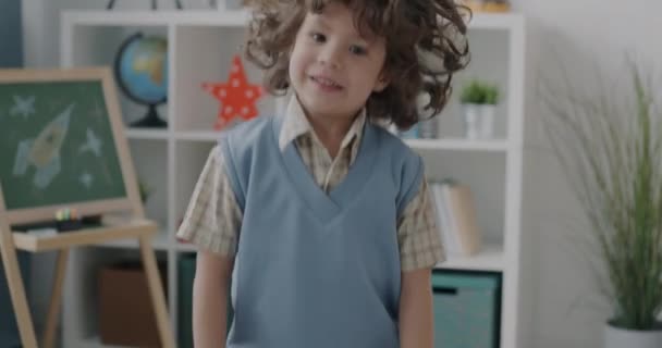 Slow Motion Joyful Little Boy Jumping Smiling Having Fun Home — Stock Video