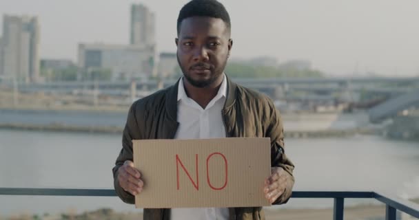Slow Motion Portrait Worried African American Man Holding Banner Standing — Stock Video