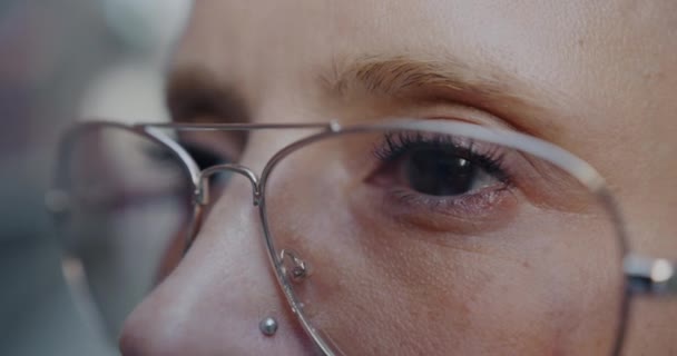 Close Portrait Young Caucasian Woman Nose Piercing Wearing Eyeglasses Looking — Stock Video