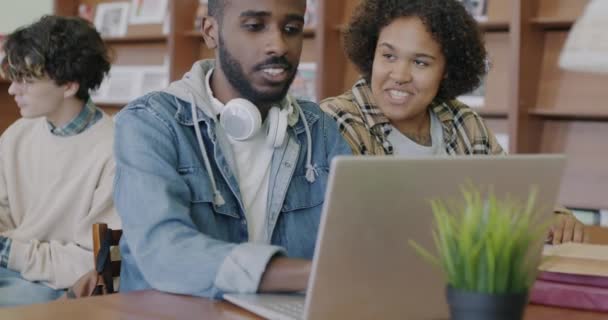 African American Students Using Laptop Looking Screen Talking Studying University — Stock Video