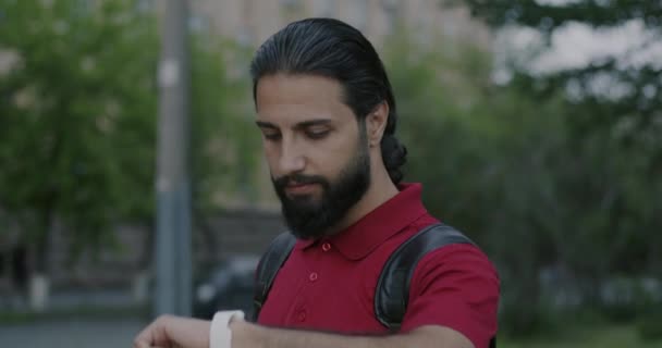 Portrait Middle Eastern Man Using Smart Watch Touching Device Standing — Video