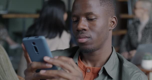 Joyful African American Entrepreneur Using Smartphone Application Smiling Modern Office — Stock Video