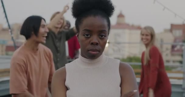 Portrait Unhappy African American Woman Standing Rooftop Party While Joyful — Stock Video