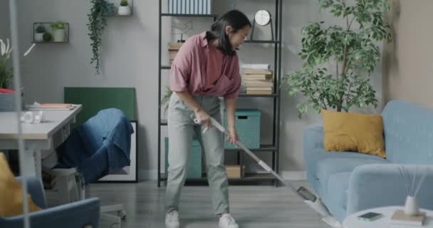 Young Asian Housewife Washing Floor Apartment Using Modern Mop Focused — Stock Video