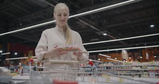Cheerful Young Woman Holding Strawberries Smelling Fruit Putting Food Supermarket — Stock Video