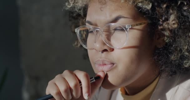 Close Portrait Creative African American Woman Student Thinking Holding Pen — Stock Video