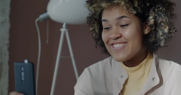 Joyful African American Girl Student Using Smartphone Making Online Video — Stockvideo