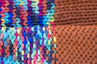 Pattern fabric made of wool. Handmade knitted fabric, color wool background texture. Textured surface, back or wrong side. Warm accessories, clothing