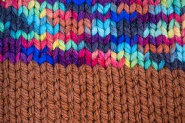 Pattern fabric made of wool. Handmade knitted fabric, color wool background texture. Warm accessories, clothing