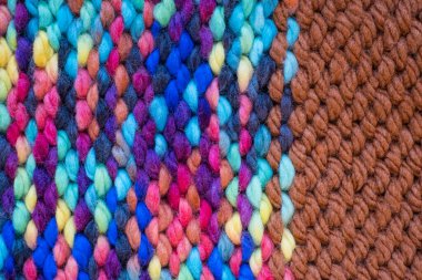 Pattern fabric made of wool. Handmade knitted fabric, color wool background texture. Textured surface, back or wrong side. Warm accessories, clothing