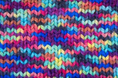 Pattern fabric made of wool. Handmade knitted fabric, color wool background texture. Warm accessories, clothing