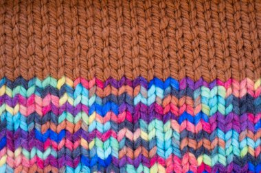 Pattern fabric made of wool. Handmade knitted fabric, color wool background texture. Warm accessories, clothing