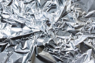 Crumpled foil texture close-up. Abstract background