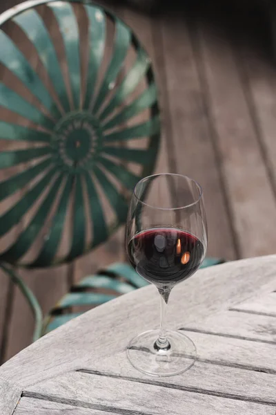 Glass Red Wine Standing Wooden Table Patio Cozy Atmosphere — Stock Photo, Image