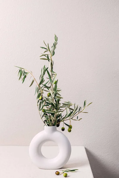 Close-up of olive branches in the vase