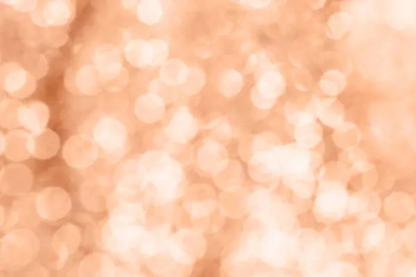 Abstract blurred background, peach color bokeh lights